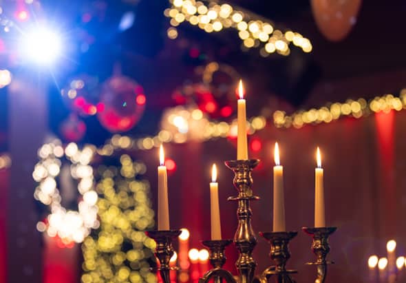 Close-up of candles and decor at a Christmas party at the Bentley Liverpool.